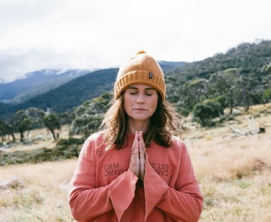 Woman in nature meditating