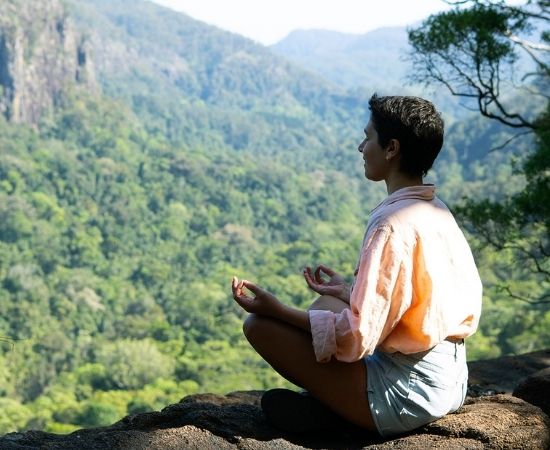 Woman meditating in nature